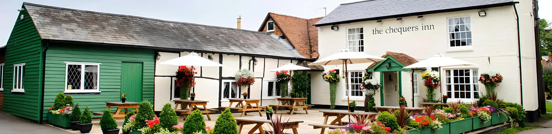 A picturesque pub garden with picnic benches