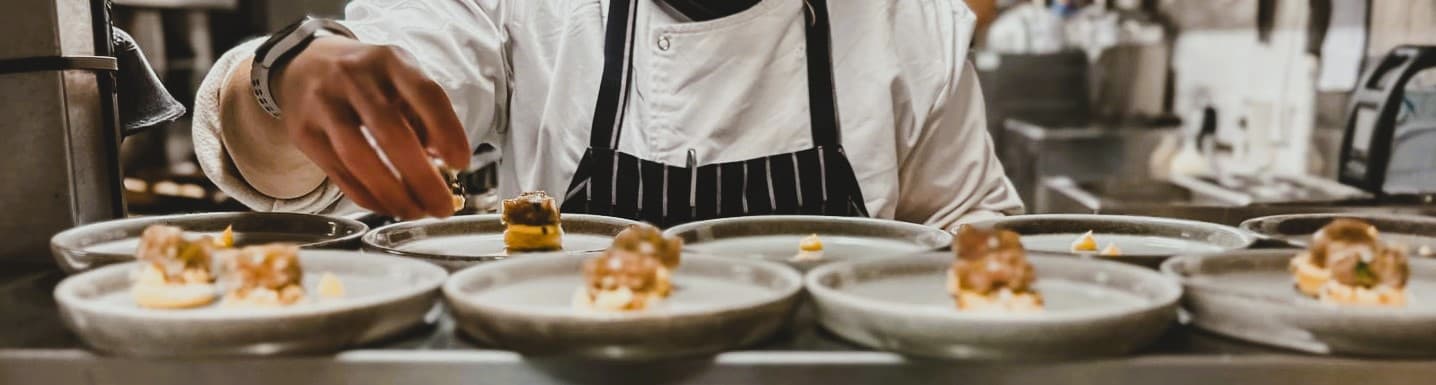 A chef serving elegant and delicious food